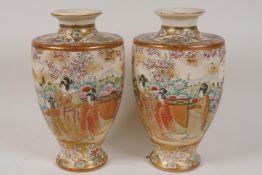 A pair of Meiji period Satsuma porcelain vases painted with figures in a continuous garden scene,