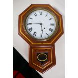 An American drop dial wall clock with painted decoration, white dial and Roman numerals, 21" long