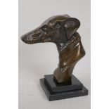 A bronze bust of a greyhound on a stepped marble plinth, 8½" high