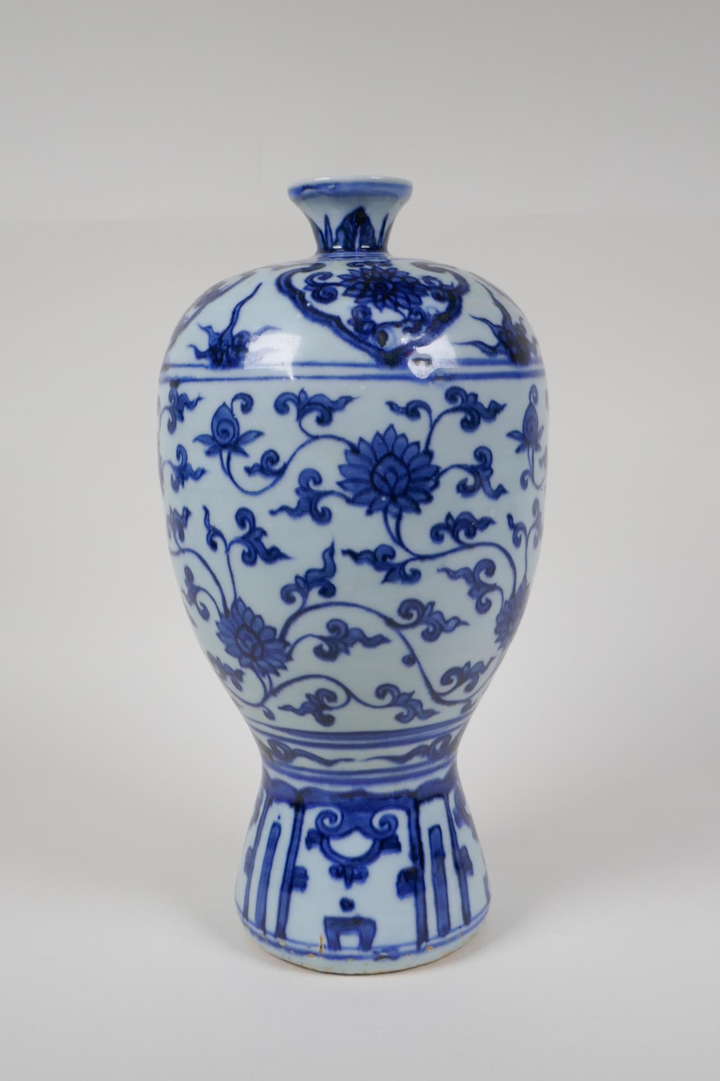 A Chinese ming style blue and white porcelain vase with scrolling lotus flower pattern, 11½" high
