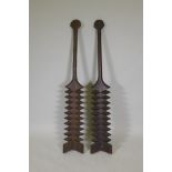 A pair of Samoan carved wood tribal paddles, 55" long