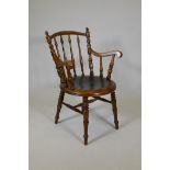 A Victorian walnut desk chair with turned back supports and pressed decoration to the seat