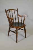 A Victorian walnut desk chair with turned back supports and pressed decoration to the seat