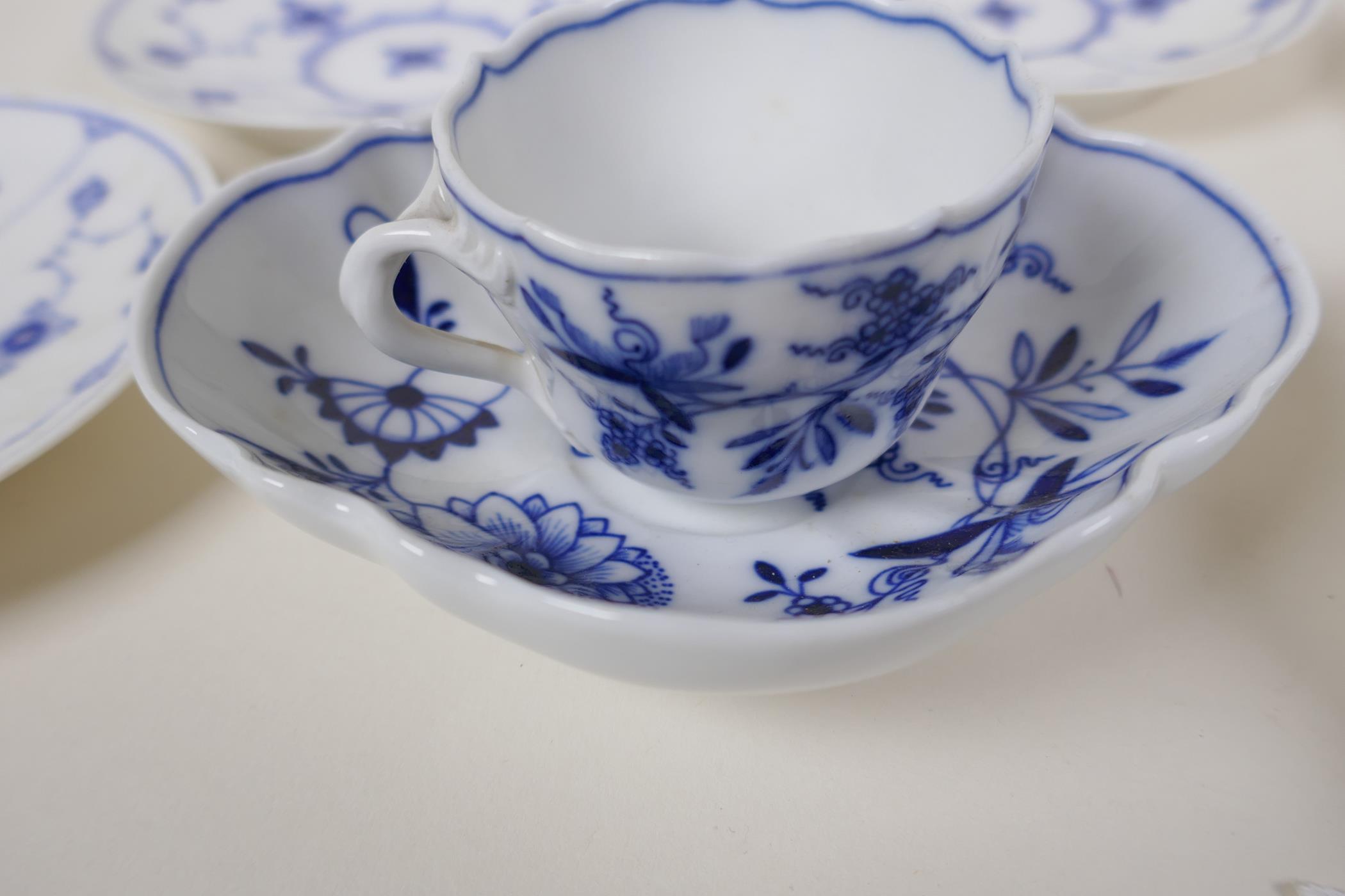 A Meissen onion pattern blue and white porcelain petal shaped cup and saucer, AF, an early - Image 8 of 9