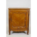A C19th French side cabinet, with single door opening to reveal a shelf and two drawers, raised on