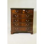 A mahogany chest of two over three moulded front drawers, raised on bracket supports, 31" x 17" x