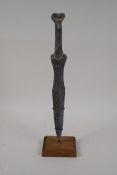 A Chinese archaic style bronze dagger, on a display stand, 15½" high