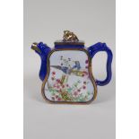 A Chinese blue and gilt enamelled Yixing teapot, with famille rose decorative panels depicting birds