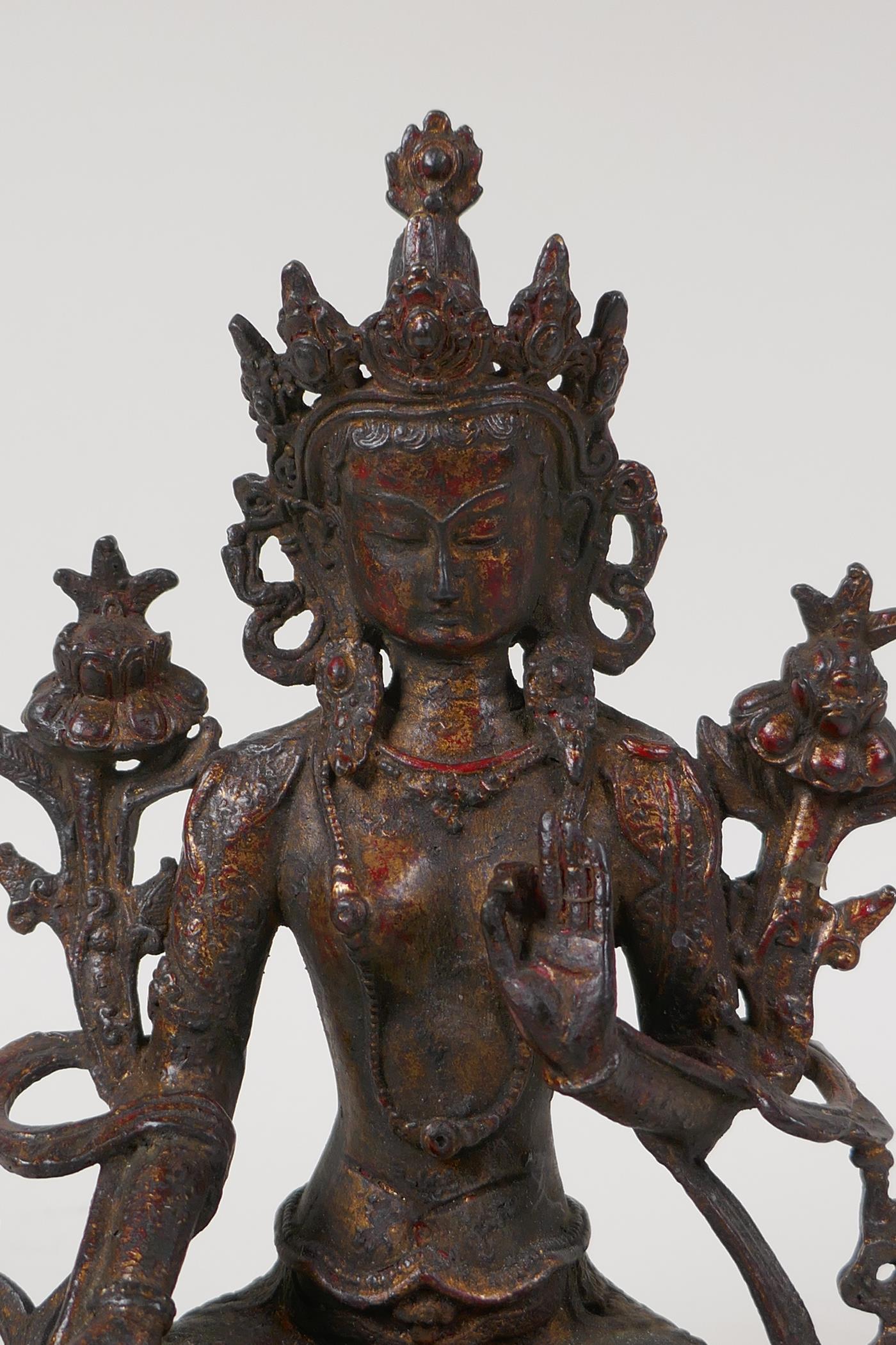 A Sino Tibetan bronze figure of Buddha seated on a lotus throne, with the remnants of gilt patina, - Image 3 of 6