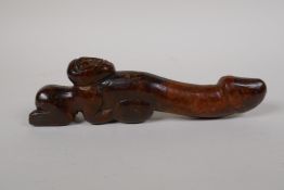 An oriental carved hardstone phallic fertility ornament, 8" long