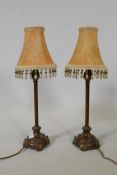 A pair of bronzed table lamps, 20" high