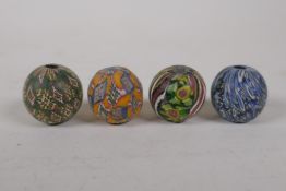 Four antique Islamic glass beads