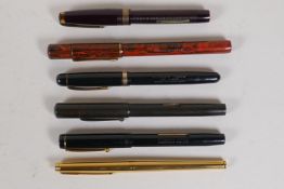 A Waterman Hundred Year Pen, four Waterman Pitman's Fono fountain pens, and a Parker fountain pen,