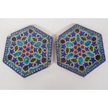 A pair of Persian hexagonal stoneware tiles painted with geometric patterns, 7" wide