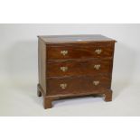 A C19th mahogany chest of three long drawers, with crossbanded top, raised on bracket supports,