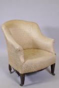 A Victorian tub shaped nursing chair, raised on square tapering supports with brass castors, 31"