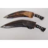 Two vintage Kukri in wood and leather sheath, one complete with sharpeners, 16" long