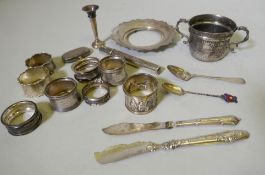 Quantity of hallmarked silver including napkin rings, cigar holder, various spoons, sovereign holder
