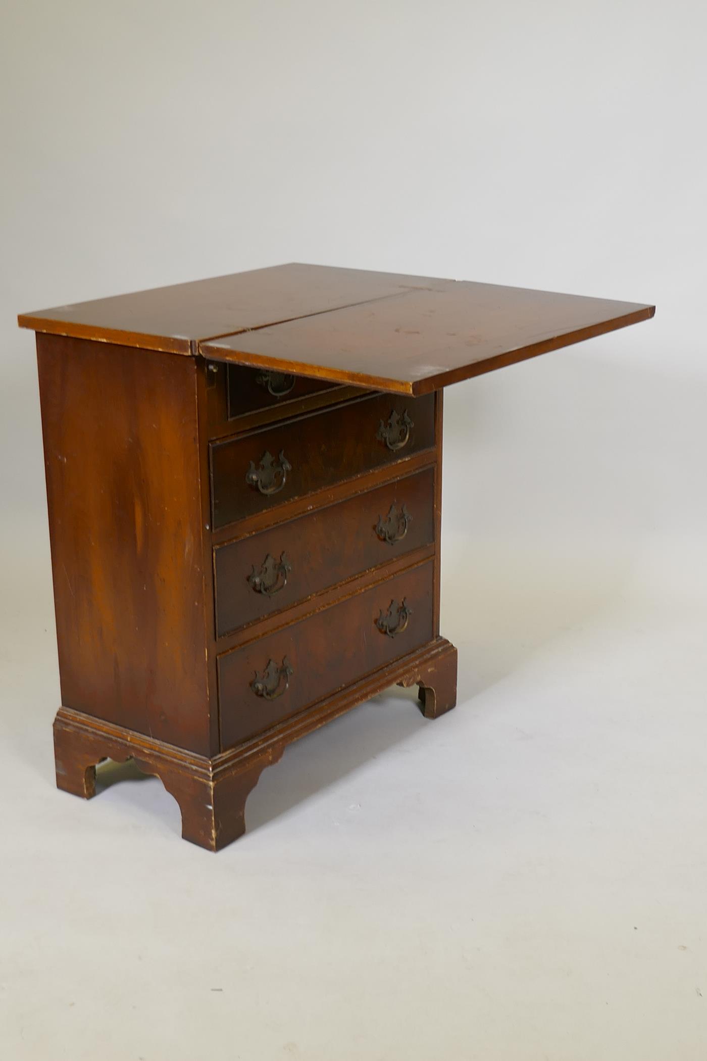 A yew wood veneered bachelor's chest, with fold out top over four drawers, raised on bracket - Image 3 of 7