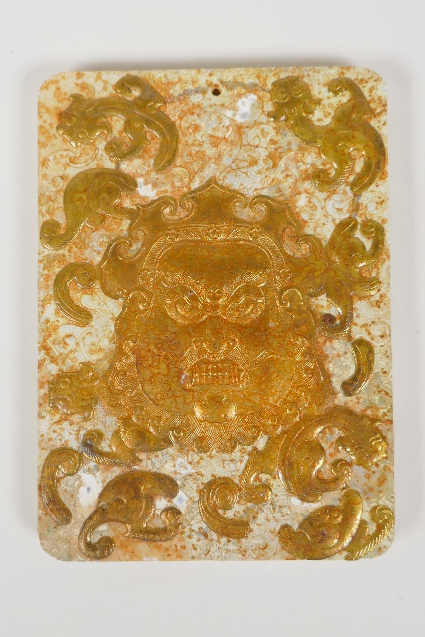 A Chinese hardstone tablet with carved and gilt mask and kylin decoration, 3½" x 4½" - Image 2 of 2