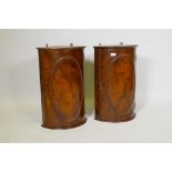 A pair of C19th figured walnut bow front hanging cupboards, 26" high