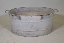 A large galvanised metal tub, 33" x 20" x 13" high