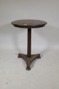 A C19th games table with inlaid chequerboard top, raised on turned column and platform base with