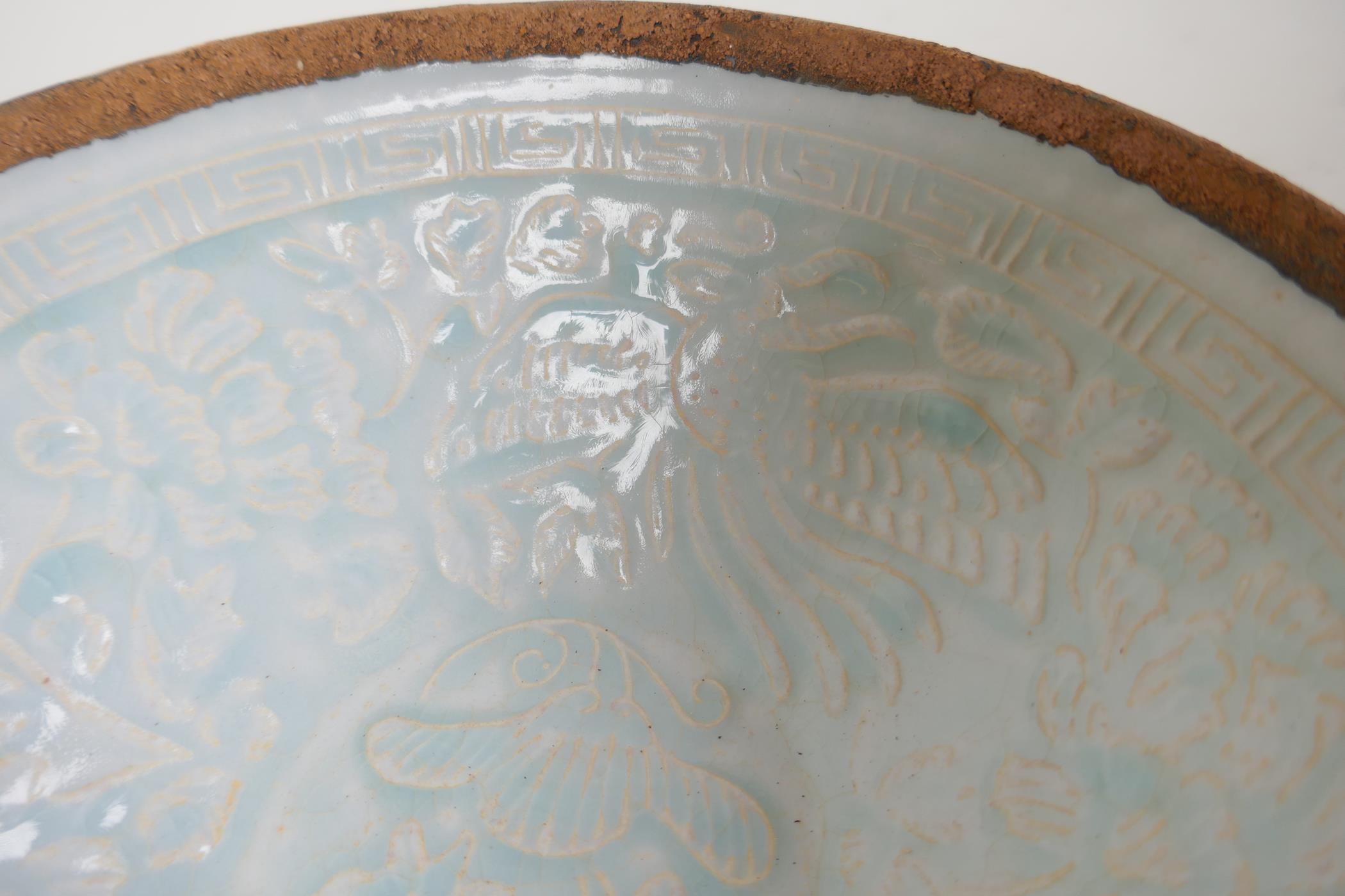 A Song style celadon glazed porcelain bowl with underglaze phoenix and lotus flower decoration, 7" - Image 5 of 7