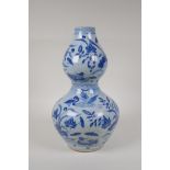 A Chinese Ming style blue and white porcelain double gourd vase, with waterfowl and lotus flower