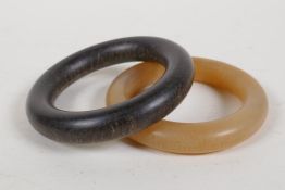 A faux horn bangle, and another, 3½" diameter