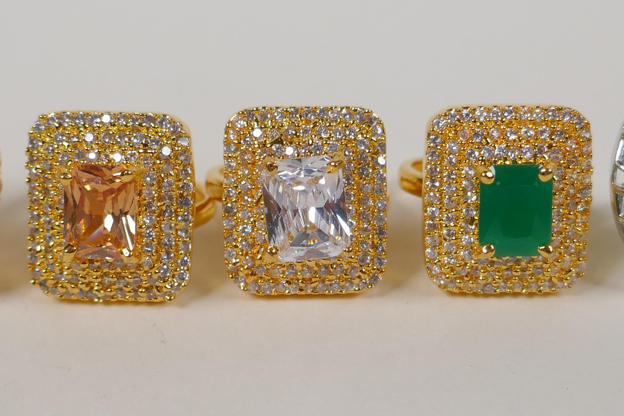 Four Indian gilt metal dress rings set with semi precious stones, and a similar silvered metal dress - Image 5 of 8