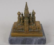 A bronze paperweight modelled as Pokrovsky Cathedral, Moscow, signed by P. Svetikov 1970, on a