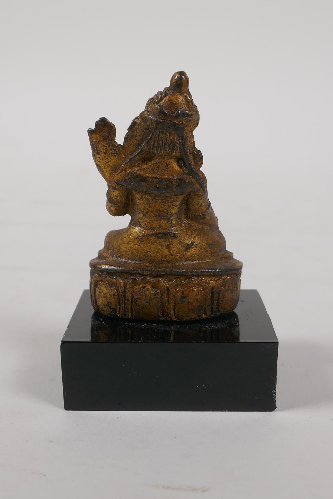 A Sino Tibetan gilt bronze figure of Buddha, on a display stand, 3" high - Image 2 of 2