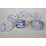 A Meissen onion pattern blue and white porcelain petal shaped cup and saucer, AF, an early