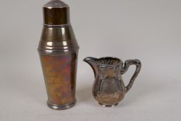 A hallmarked silver cocktail shaker (damaged), 416g, and a continental silver cream jug with Art