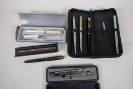 A collection of pens and pen sets including a Parker Sonnet fountain pen