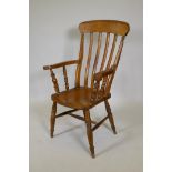 A Windsor bar back arm chair with elm seat, 43" high