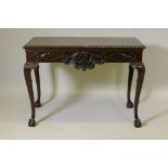 A mahogany centre table, the top with gadrooned edge, the frieze with all round carved decoration,