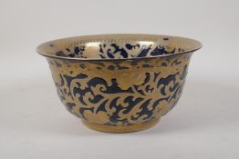 A Chinese powder blue glazed porcelain bowl with gilt scrolling floral decoration, seal mark to