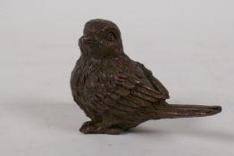 A Japanese bronze okimono of a small bird, 1½" long