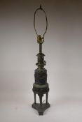 A patinated pressed brass table lamp in a Renaissance revival style, 35" high