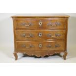 A late C19th French walnut serpentine front commode, with three drawers and moulded panel ends,