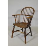 A C19th double hoop back Windsor armchair with an elm seat, AF