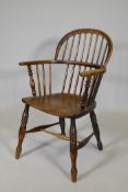 A C19th double hoop back Windsor armchair with an elm seat, AF