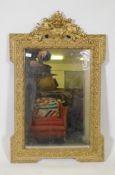 A late C19th French giltwood and composition wall mirror with pierced crest and original mirror