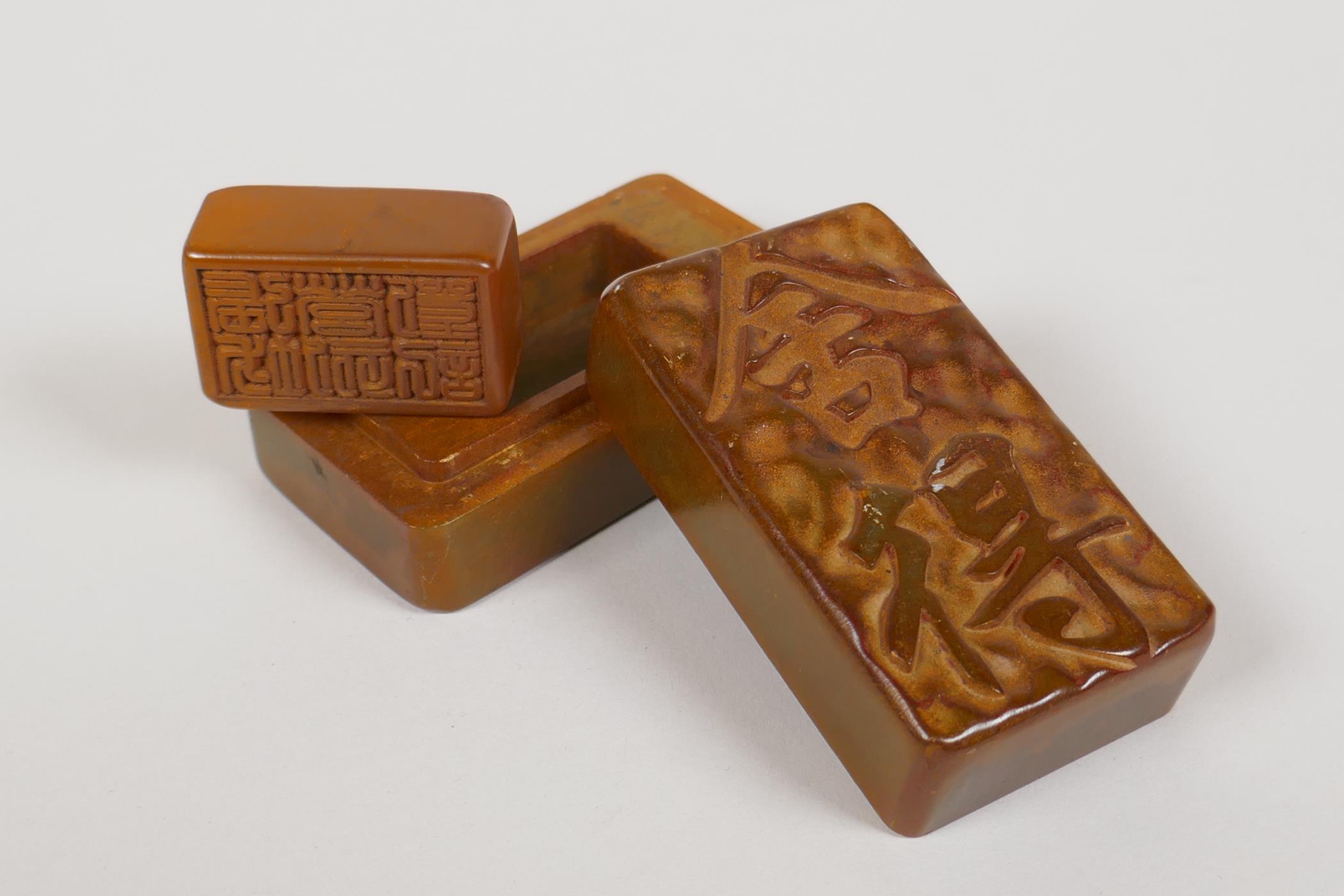 A Chinese soapstone seal box with carved character decoration to the cover, opening to reveal a - Image 2 of 3