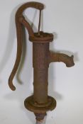 A vintage cast iron water pump, 31" long