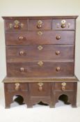 An early C18th oak chest on stand, the upper section with three drawers over three drawers, and