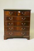 A mahogany chest of two over three moulded front drawers, raised on bracket supports, 31" x 17" x