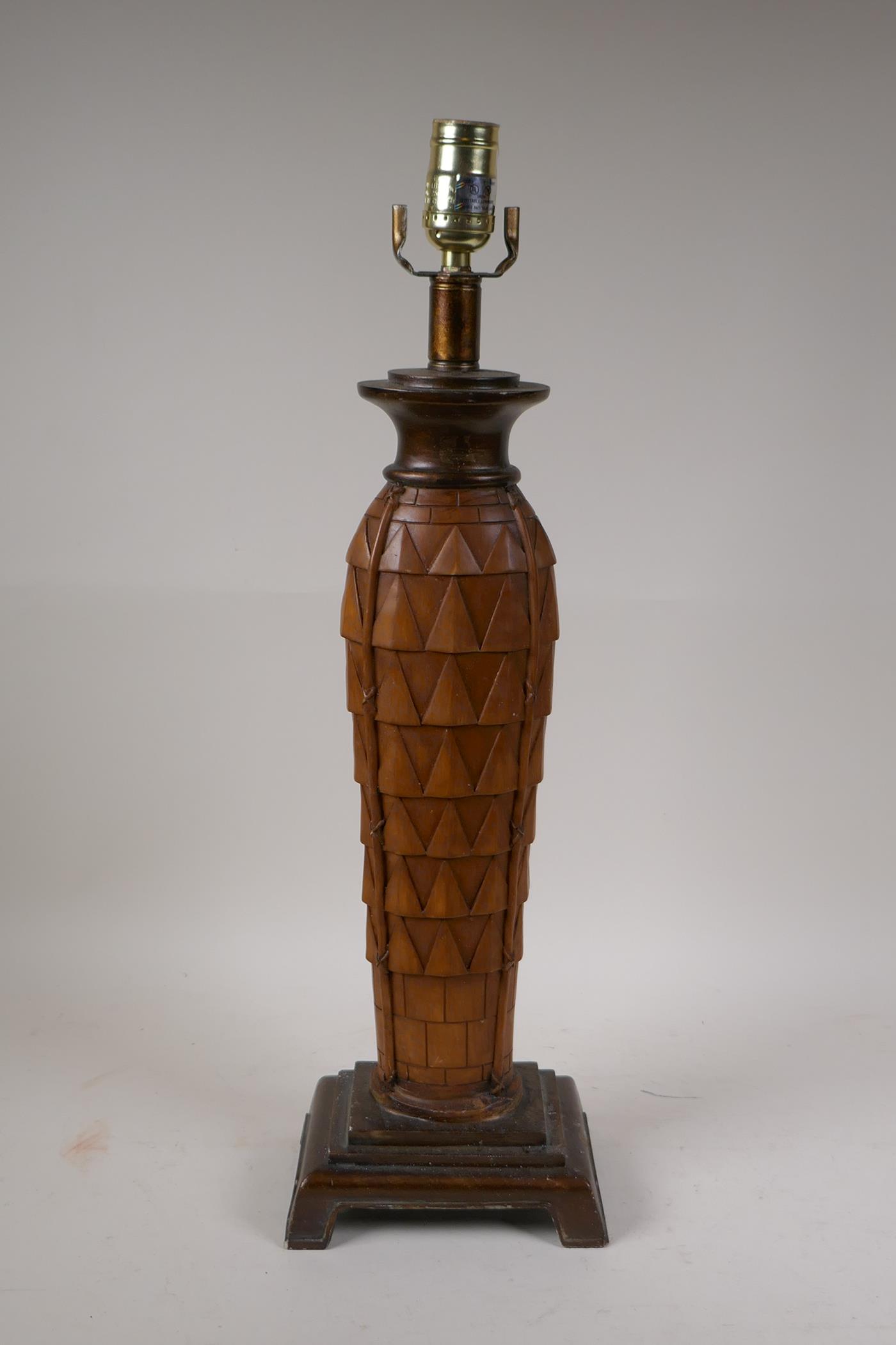 A bamboo and wood style composition table lamp